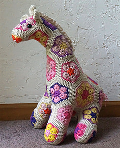 white and blue giraffe plush toy thumbnail
