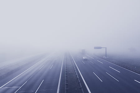 black car on top of toproad with foggy weather thumbnail