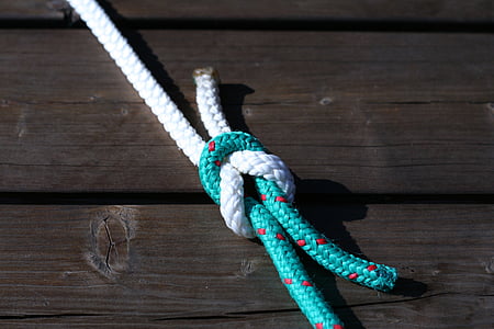 white and green tied rope on wooden surface thumbnail