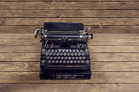 black typewriter on brown surface thumbnail