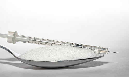 closeup photography of syringe and silver spoon thumbnail