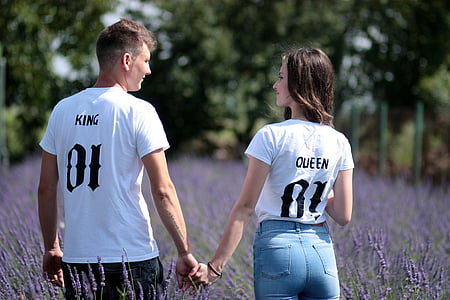 man and woman in white crew-neck shirts thumbnail