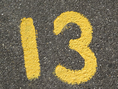 yellow number 13 printed on gray surface thumbnail
