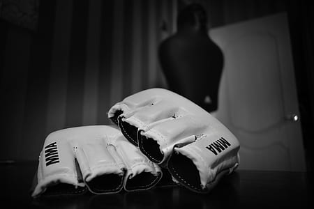 pair of white MMA gloves on table thumbnail
