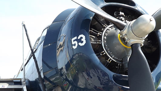 closeup photography of black plane at daytime thumbnail