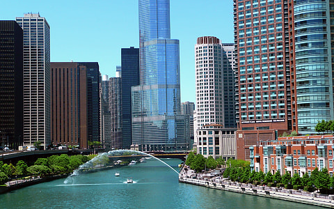 aerial photography of body of water near buildings at daytime thumbnail