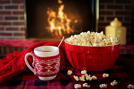 red bowl of popcorn beside coffee mug thumbnail