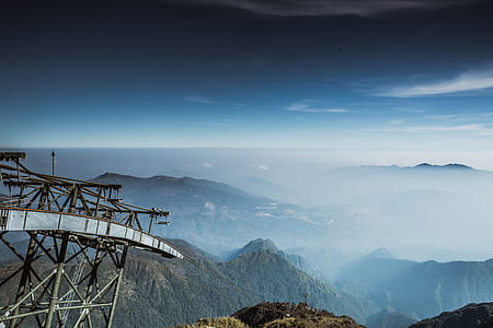 aerial view photography of mountain covered by clouds during daytime thumbnail