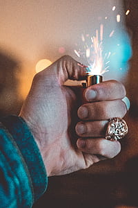 person igniting disposable lighter thumbnail