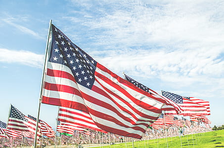 USA flag under blue sky thumbnail
