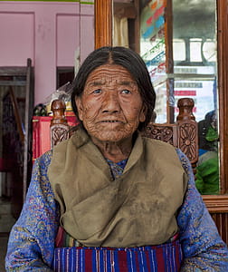 Woman in Brown and Blue Traditional Dress thumbnail
