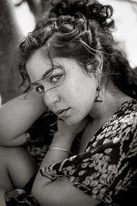 grayscale photography of woman in floral shirt thumbnail