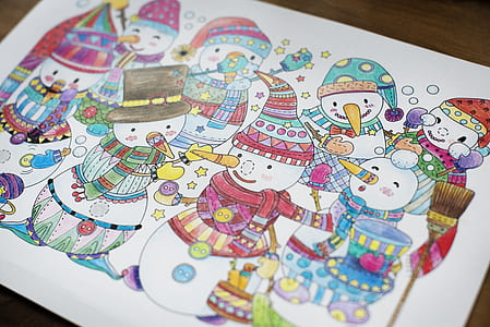 Snowman Drawing on White Wooden Table thumbnail