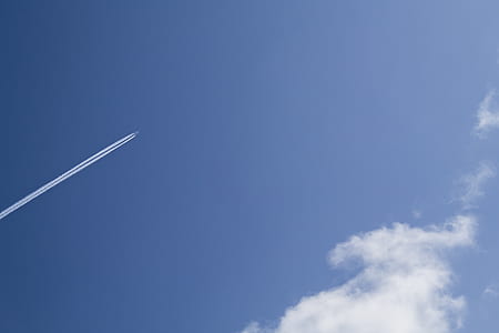 Jet Under Clear Blue Sky during Daytime thumbnail