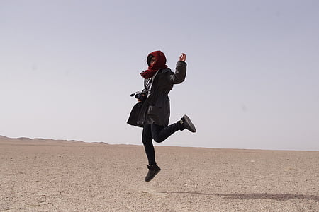 woman jumping during daytime thumbnail