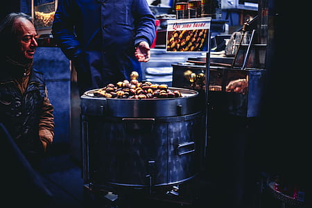 Man Sitting and Looking on Chestnuts thumbnail