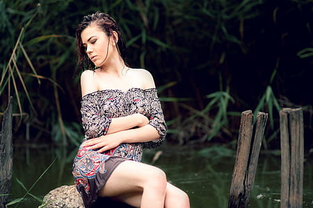 woman sitting on rock thumbnail