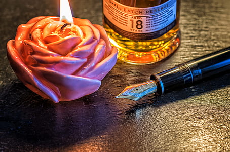 pink flower lit candle thumbnail