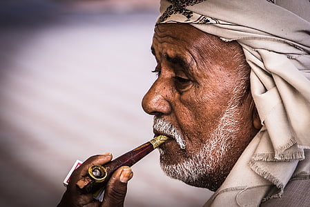 man with pipe and white bandana thumbnail