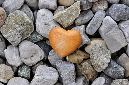 heart brown wooden box on gray stones thumbnail