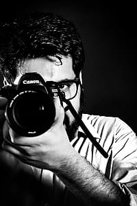 Man Taking Picture Front of Camea thumbnail