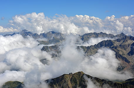 rock mountain with white clouds thumbnail