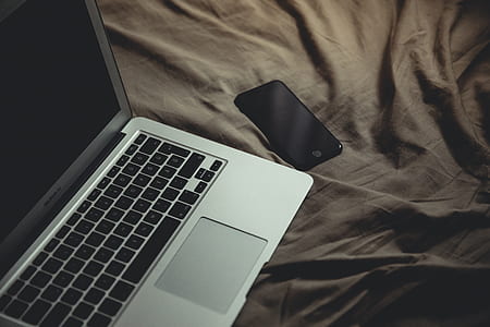 MacBook Air beside post-2014 iPhone thumbnail