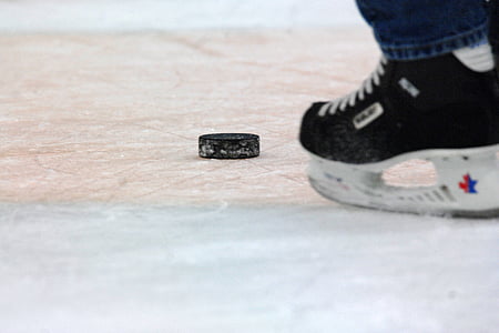 person playing ice hockey on court thumbnail