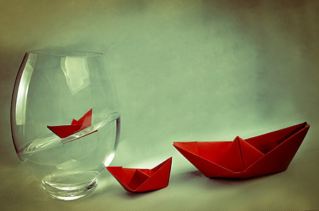 red paper boat and glass thumbnail