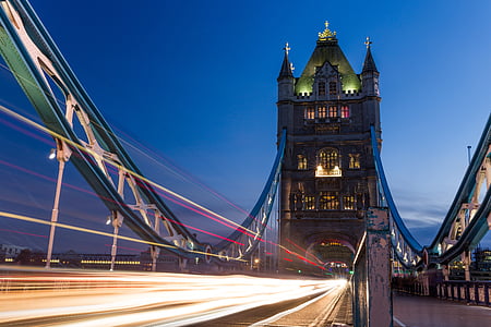 time-lapse photography of vehicles on bridge at nighttime thumbnail