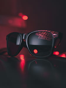 black Ray-Ban Wayfarer sunglasses on black surface thumbnail