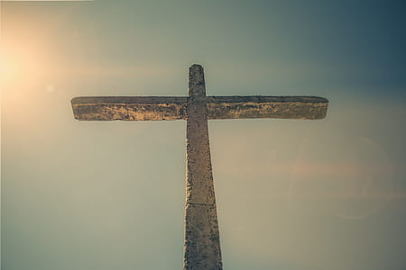 concrete cross under blue sky thumbnail