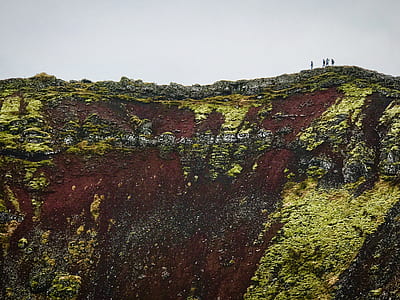 people on top of the mountain during daytime thumbnail