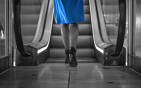 selective color photography of woman in blue dress thumbnail