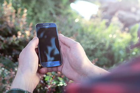 person holding Samsung smartphone thumbnail