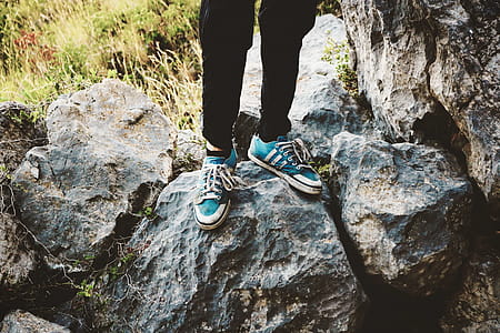 Person Standing on Gray Rock thumbnail