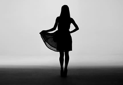 silhouette of a woman wearing dress thumbnail