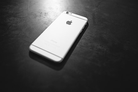silver iPhone 6 above black wooden surface thumbnail