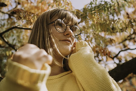 woman standing under tree thumbnail