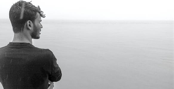 Gray Scale Photo Of Man Wearing Black Shirt thumbnail
