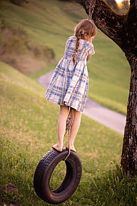 girl ride on vehicle tire swing thumbnail