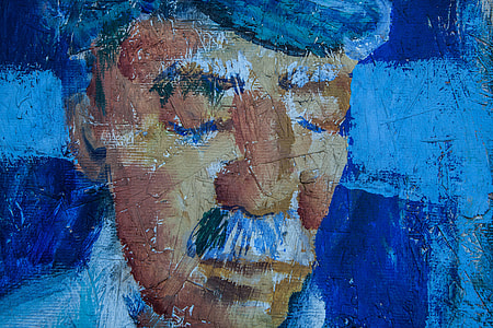 Close-up shot of old face art on a wooden background, image captured in Kent, England thumbnail