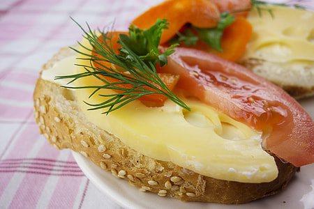 slice of wheat bread, cheese, and tomato thumbnail