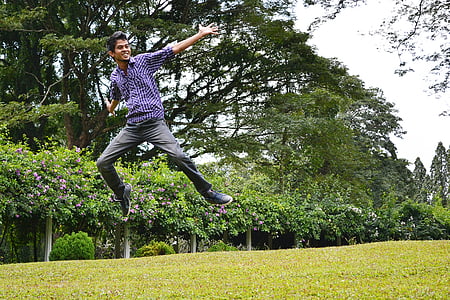 timelapse photography of man jumping on grasses thumbnail