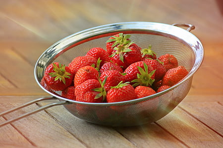 bunch of strawberry fruits on strainer thumbnail