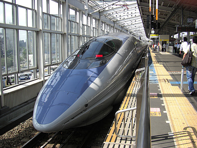 bullet train spots at train train station thumbnail