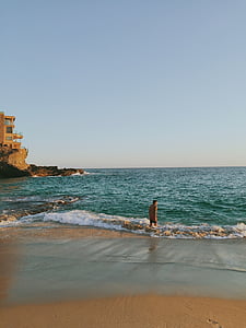 person on seashore during daytime thumbnail