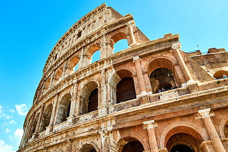 Coliseum under blue cloudy sky thumbnail