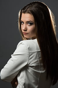 brunet woman wearing white leather jacket thumbnail