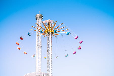 assorted-color amusement park ride at daytime thumbnail
